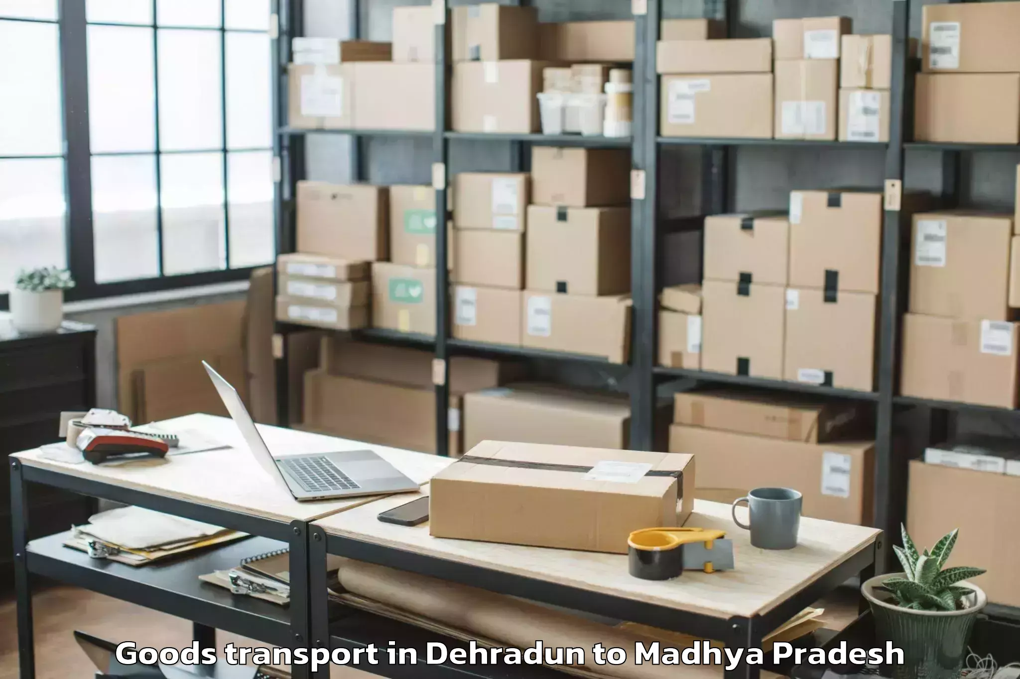 Discover Dehradun to Alot Goods Transport